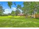 Expansive backyard surrounded by mature trees, offering privacy and ample space at 1023 Striper Ave, Moncks Corner, SC 29461