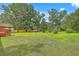 Sprawling backyard featuring lush green grass and mature trees at 1023 Striper Ave, Moncks Corner, SC 29461