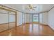 Spacious bedroom featuring hardwood floors, a mirrored closet, and bright bay windows at 1023 Striper Ave, Moncks Corner, SC 29461