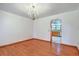 Bright dining room with hardwood floors and a chandelier, opens to the kitchen at 1023 Striper Ave, Moncks Corner, SC 29461