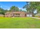 Charming brick home with well-manicured lawn and a convenient attached three-car garage at 1023 Striper Ave, Moncks Corner, SC 29461
