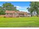 Charming brick home with well-manicured lawn and a convenient attached three-car garage at 1023 Striper Ave, Moncks Corner, SC 29461