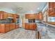 Well-equipped kitchen features tile floors, wood cabinets, and plenty of counter space at 1023 Striper Ave, Moncks Corner, SC 29461