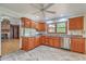 Charming kitchen with wood cabinets, stainless steel appliances, and tile floors at 1023 Striper Ave, Moncks Corner, SC 29461