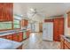 Spacious kitchen features wood cabinets, stainless steel appliances, and views of the backyard at 1023 Striper Ave, Moncks Corner, SC 29461