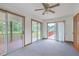 Bright sun room with sliding doors leading to the outdoor deck and a view of trees at 1023 Striper Ave, Moncks Corner, SC 29461