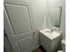 Cozy powder room featuring a modern vanity with quartz countertop and a mirror at 103 River Hill Rd, Goose Creek, SC 29445