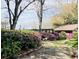 Beautiful backyard with a winding path bordered by azaleas leading to an outbuilding at 1039 Grand Concourse St, Charleston, SC 29412