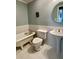 Elegant bathroom featuring a clawfoot tub and pedestal sink, blending vintage charm with modern convenience at 1039 Grand Concourse St, Charleston, SC 29412
