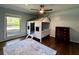Charming bedroom features unique house-shaped bed frame, complemented by stylish decor and ample natural light at 1039 Grand Concourse St, Charleston, SC 29412