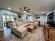 Comfortable living room featuring a large sectional sofa, wood accents, and open layout to the dining area at 1039 Grand Concourse St, Charleston, SC 29412