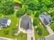 Aerial view of a home with lush landscaping, backyard pond, and mature trees at 107 Oakbluff Rd, Summerville, SC 29485