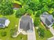 Aerial view of a home with lush landscaping, a pond, and a sprawling lawn at 107 Oakbluff Rd, Summerville, SC 29485