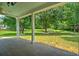 Spacious backyard featuring a covered patio and landscaped lawn, perfect for outdoor entertaining and relaxation at 107 Oakbluff Rd, Summerville, SC 29485