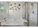 Bright bathroom featuring a large soaking tub and a glass-enclosed shower at 107 Oakbluff Rd, Summerville, SC 29485