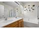 Bathroom with double sink vanity, soaking tub, and glass-enclosed shower at 107 Oakbluff Rd, Summerville, SC 29485