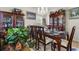 Traditional dining room with wood furniture, china cabinet, and large windows allowing natural light at 107 Oakbluff Rd, Summerville, SC 29485