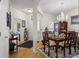 Elegant dining room featuring a chandelier, wood floors, and furniture with views into the foyer and front door at 107 Oakbluff Rd, Summerville, SC 29485
