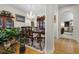 Formal dining room boasts hardwood floors, a chandelier, and arched openings with views to other rooms at 107 Oakbluff Rd, Summerville, SC 29485