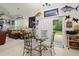 Bright dining area with a glass-top table, seating for four, and sliding doors to the porch at 107 Oakbluff Rd, Summerville, SC 29485