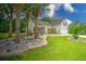 Beautiful home with a lush lawn, complemented by mature trees and landscaping, enhancing its overall appeal at 107 Oakbluff Rd, Summerville, SC 29485