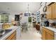 Bright kitchen featuring a breakfast table, light wood cabinets, tile floors, and quirky marine decorations at 107 Oakbluff Rd, Summerville, SC 29485