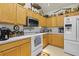 Functional kitchen with white appliances, oak cabinets, and ample counter space at 107 Oakbluff Rd, Summerville, SC 29485