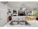 A partial view of the kitchen sink area, opening up to the living room space with unique marine decor at 107 Oakbluff Rd, Summerville, SC 29485