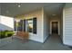 Inviting front porch with a wooden bench, perfect for enjoying the outdoors at 108 Orchard Blossom Ln, Summerville, SC 29485