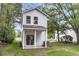 Backyard view of a charming two-story home with a covered patio and green lawn at 110 Farm Rd # A, Goose Creek, SC 29445