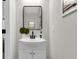 Modern bathroom with a white vanity, sleek mirror, and contemporary fixtures at 110 Farm Rd # A, Goose Creek, SC 29445