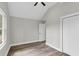 Bright bedroom features wood-look flooring, vaulted ceiling, and a ceiling fan at 110 Farm Rd # A, Goose Creek, SC 29445