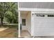 The well-lit front door and garage of this lovely home showcases the house number: 110A at 110 Farm Rd # A, Goose Creek, SC 29445