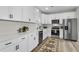 Bright kitchen featuring white cabinets, stainless steel appliances, and modern countertops at 110 Farm Rd # A, Goose Creek, SC 29445