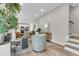 Bright, open living room with modern furniture, plants, and seamless flow to kitchen at 110 Farm Rd # A, Goose Creek, SC 29445