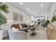 Inviting open-concept living room with a modern kitchen in background with stainless appliances at 110 Farm Rd # A, Goose Creek, SC 29445