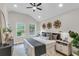 Stylish main bedroom with a ceiling fan, large windows and decorative accents at 110 Farm Rd # A, Goose Creek, SC 29445