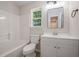 Bathroom featuring a white vanity, square mirror, and a shower-tub combination at 110 Yorkshire Dr, Summerville, SC 29483
