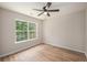 Comfortable bedroom featuring hardwood flooring and natural light from a large window at 110 Yorkshire Dr, Summerville, SC 29483