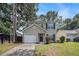 Inviting two-story home with a well-manicured lawn, attached garage, and classic curb appeal at 110 Yorkshire Dr, Summerville, SC 29483