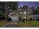 Inviting two-story home with a well-manicured lawn, attached garage, and classic curb appeal at 110 Yorkshire Dr, Summerville, SC 29483