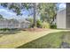 Spacious backyard with a large tree and privacy fence and view of the home's exterior at 1104 Greenmeadow Dr, Goose Creek, SC 29445