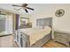 Bedroom featuring wood floors, a ceiling fan and a grey bed frame with access to an outdoor patio at 1104 Greenmeadow Dr, Goose Creek, SC 29445
