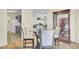 Open-concept dining room with seating for four and a view into the kitchen at 1104 Greenmeadow Dr, Goose Creek, SC 29445