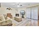 Inviting living room with a fireplace and sliding glass doors to the backyard at 1104 Greenmeadow Dr, Goose Creek, SC 29445