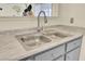 Close up of a modern kitchen sink and countertop, with gray cabinets below at 1104 Greenmeadow Dr, Goose Creek, SC 29445
