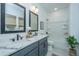 Bathroom featuring a dual sink vanity, tile flooring, and neutral color palette at 111 Augusta Pass Dr, Ridgeville, SC 29472