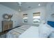 Well-lit bedroom with a ceiling fan, window views, and a peaceful retreat at 111 Augusta Pass Dr, Ridgeville, SC 29472