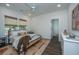 Bright bedroom with a modern bed frame, stylish rug, and a ceiling fan at 111 Augusta Pass Dr, Ridgeville, SC 29472