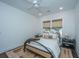 Bright bedroom features a modern bed frame, stylish rug, and natural light at 111 Augusta Pass Dr, Ridgeville, SC 29472